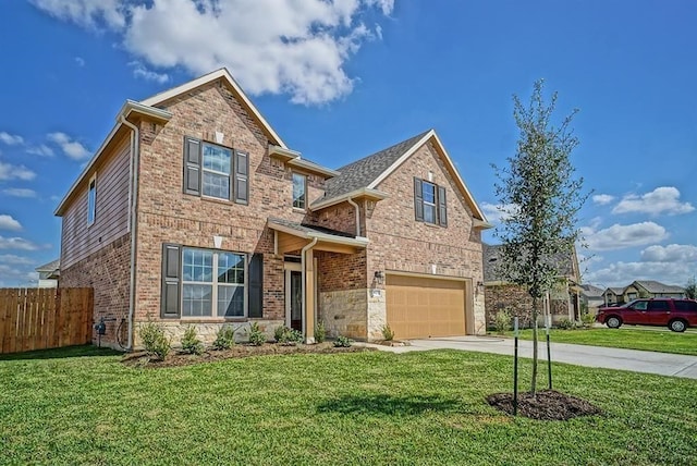 view of front of property with a garage and a front yard