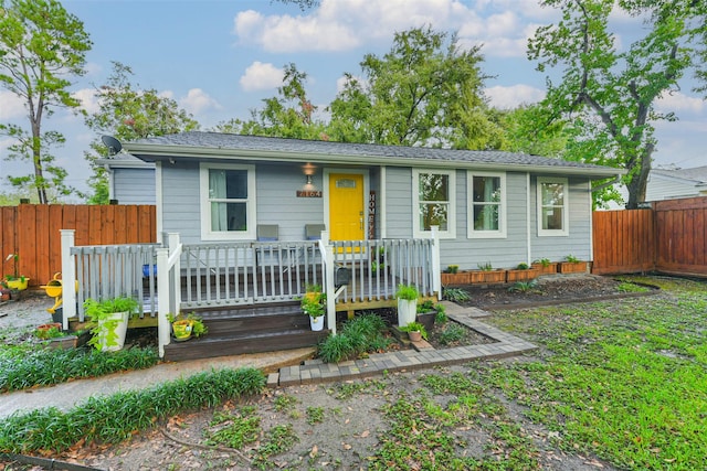 ranch-style house featuring a wooden deck