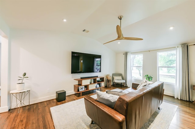 living room featuring ceiling fan, lofted ceiling, and hardwood / wood-style flooring