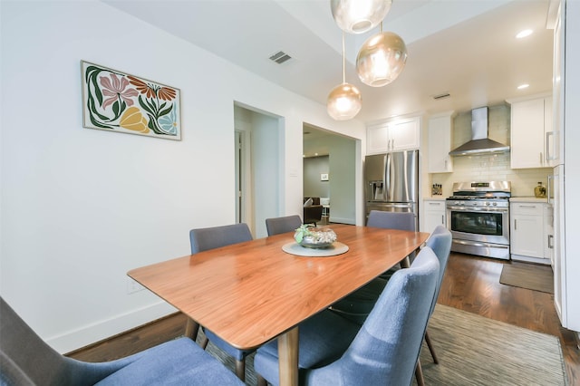 dining area with dark wood-type flooring