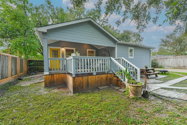 rear view of property featuring a patio