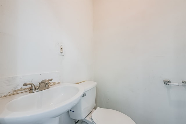 bathroom with toilet and sink