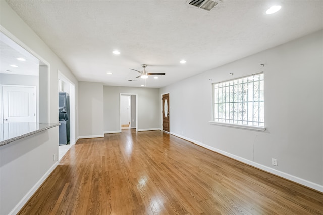 unfurnished room with light hardwood / wood-style floors and ceiling fan