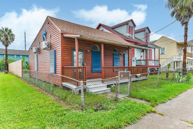 view of front of home with covered porch and a front yard