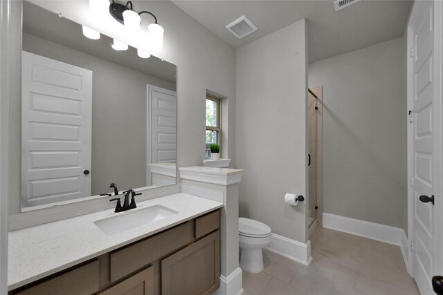 bathroom with walk in shower, toilet, and vanity