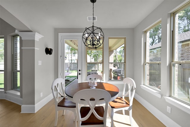 dining area featuring light hardwood / wood-style flooring and a healthy amount of sunlight