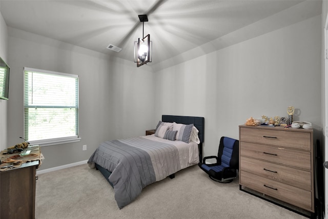 bedroom featuring light carpet