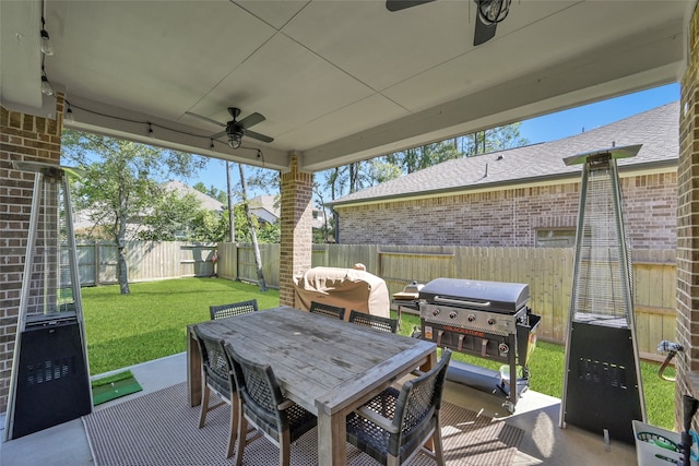 view of patio / terrace with ceiling fan and grilling area