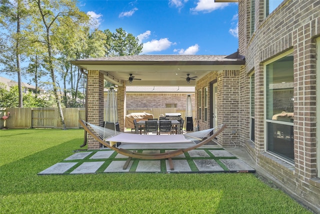 view of patio / terrace featuring ceiling fan