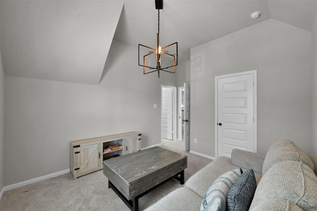 carpeted living room featuring high vaulted ceiling and a notable chandelier