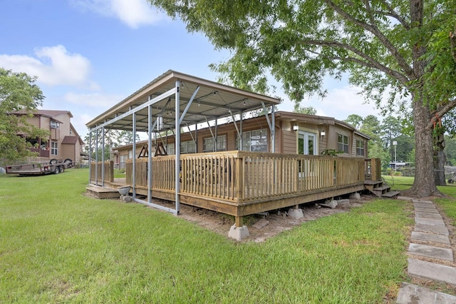 deck with a lawn and a detached carport