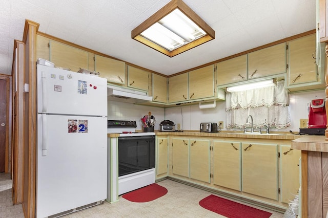 kitchen with white appliances, light countertops, under cabinet range hood, and light floors