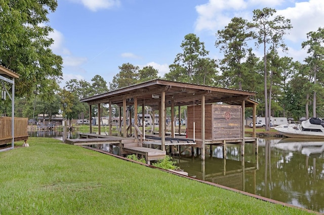 view of dock with a water view, boat lift, and a lawn