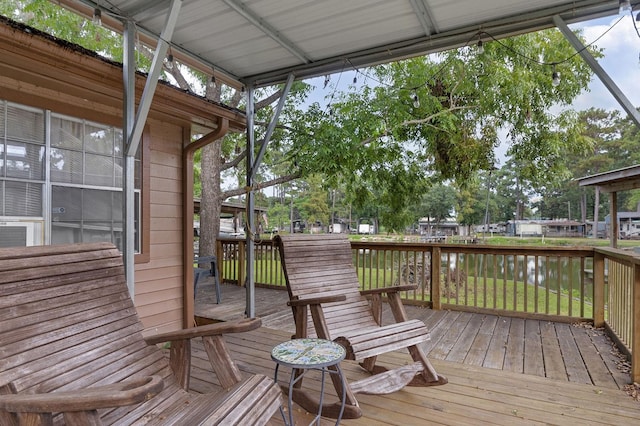 wooden deck with a water view