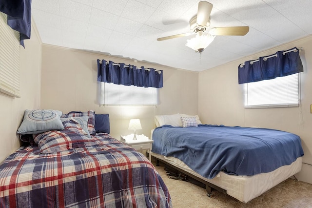 carpeted bedroom featuring a ceiling fan