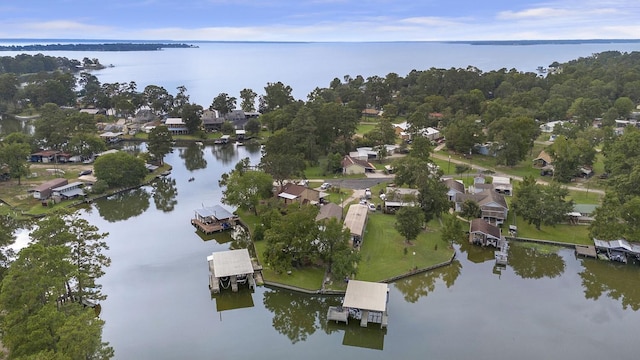 birds eye view of property with a water view and a residential view