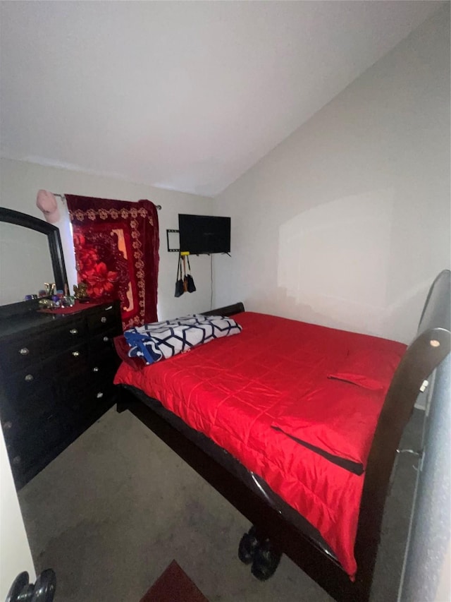 carpeted bedroom featuring vaulted ceiling