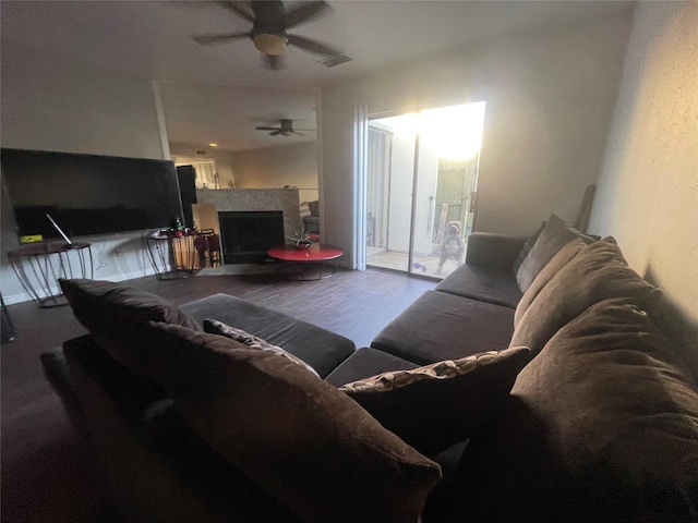 living room featuring ceiling fan and wood-type flooring