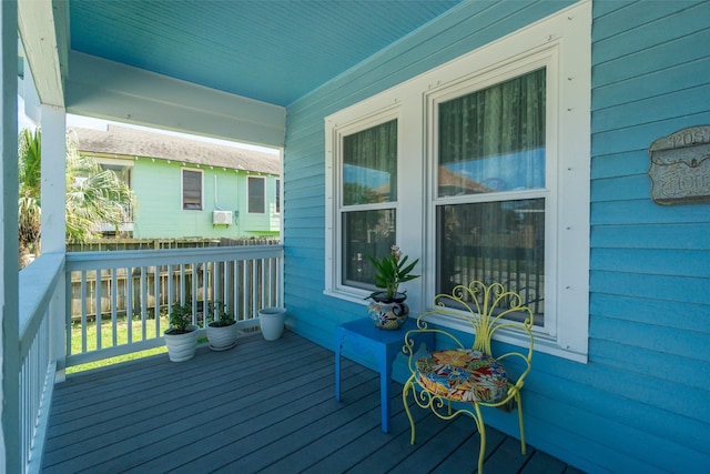 wooden terrace with a porch