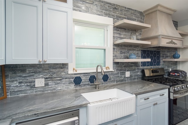 kitchen featuring backsplash, stainless steel appliances, and white cabinets