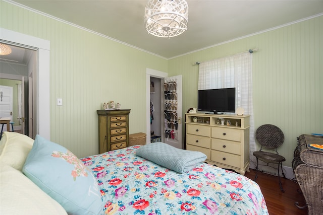 bedroom featuring ornamental molding and wood-type flooring