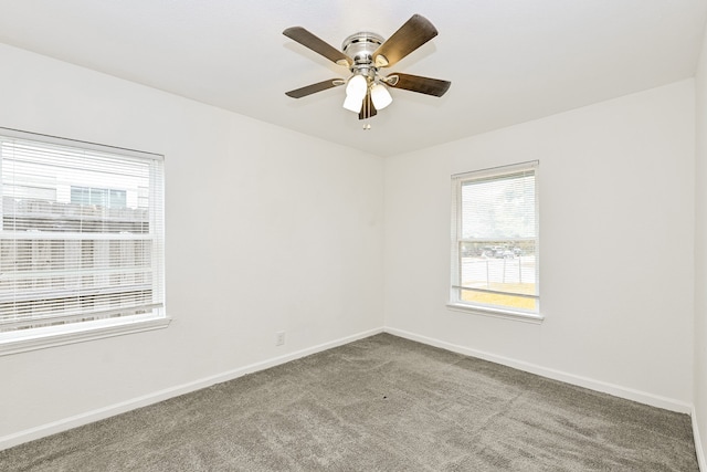 spare room with carpet and ceiling fan