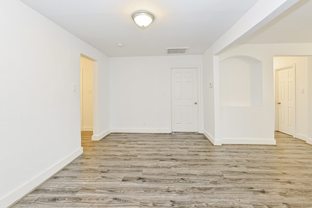 spare room featuring light hardwood / wood-style flooring