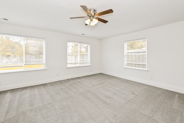 carpeted empty room with ceiling fan