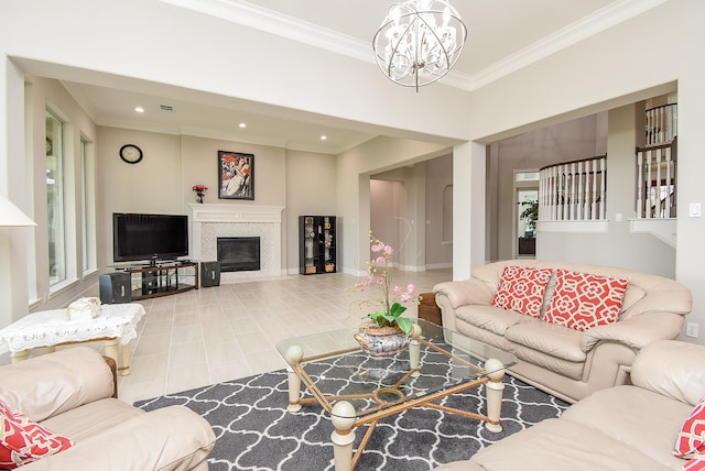 living room featuring crown molding, an inviting chandelier, light tile patterned floors, and a fireplace