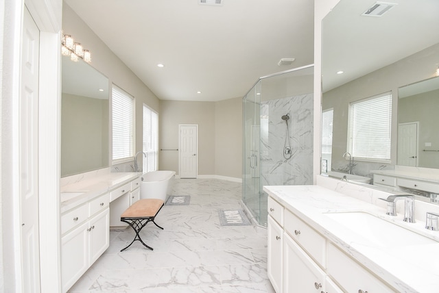 bathroom featuring shower with separate bathtub and vanity