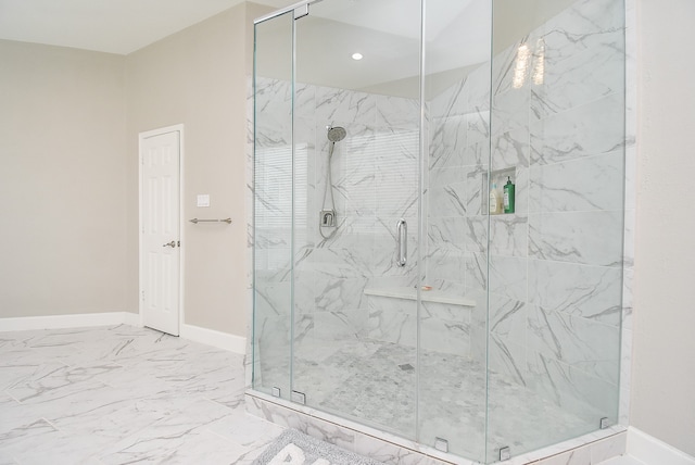 bathroom featuring a shower with shower door