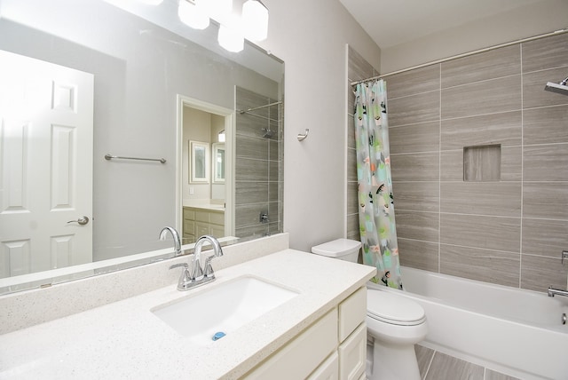 full bathroom featuring shower / bath combo with shower curtain, tile patterned flooring, toilet, and vanity