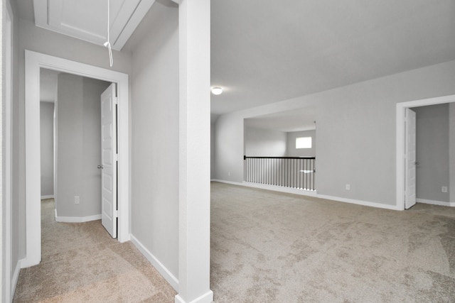 interior space featuring light carpet