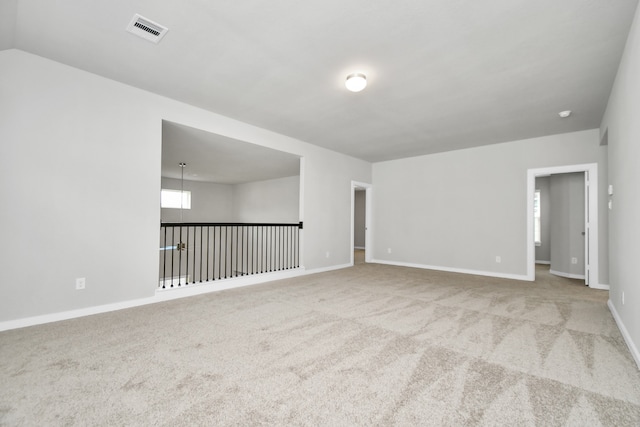 spare room featuring carpet floors
