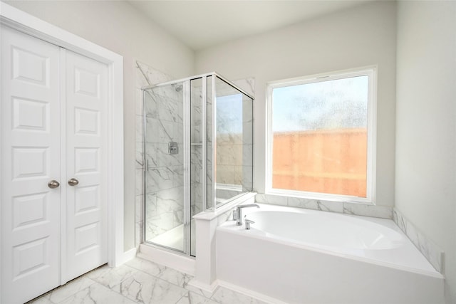 15327 Statice Trl, Houston, TX 77044 - bathroom with marble finish flooring, a bath, and a marble finish shower