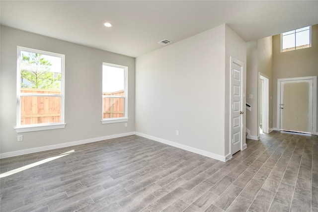 unfurnished room with light wood-type flooring