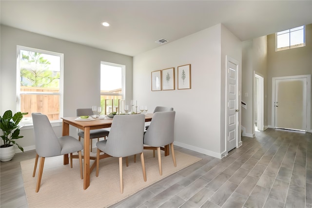 dining space with light hardwood / wood-style flooring