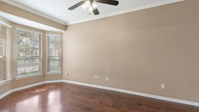 empty room featuring ceiling fan, dark hardwood / wood-style floors, and ornamental molding