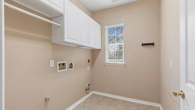 laundry room featuring hookup for a washing machine, cabinets, gas dryer hookup, light tile patterned floors, and hookup for an electric dryer