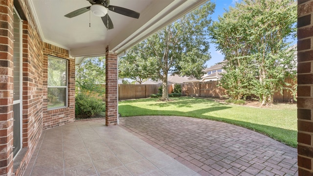 view of patio featuring ceiling fan