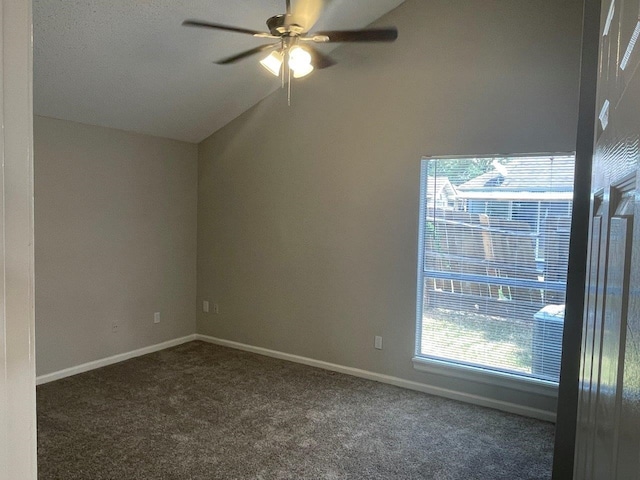 carpeted spare room featuring lofted ceiling and ceiling fan