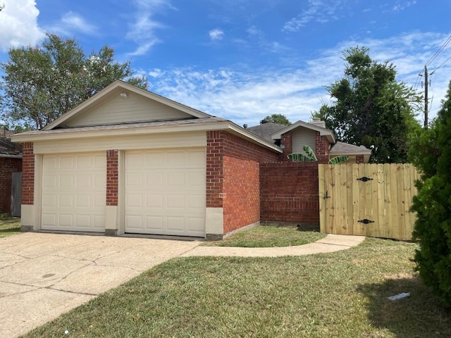 exterior space with a garage and a lawn