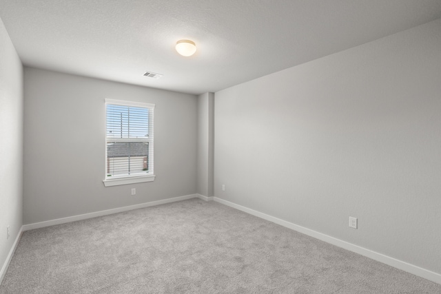 unfurnished room with carpet flooring