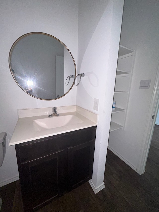 bathroom featuring vanity and hardwood / wood-style flooring