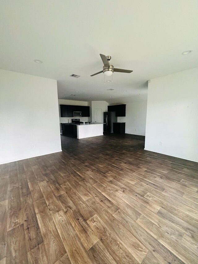 unfurnished living room with ceiling fan and hardwood / wood-style flooring