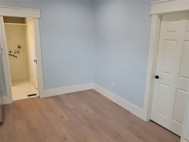 empty room featuring light hardwood / wood-style floors