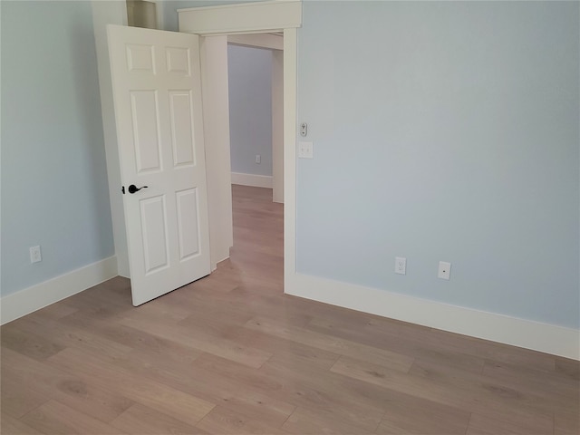 unfurnished room featuring light wood-type flooring