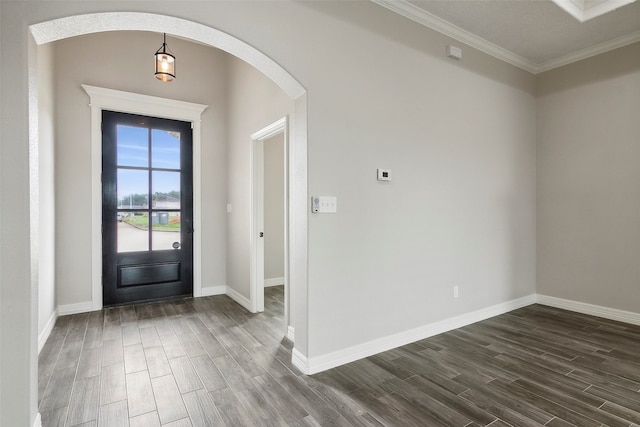 entrance foyer featuring dark hardwood / wood-style floors and ornamental molding