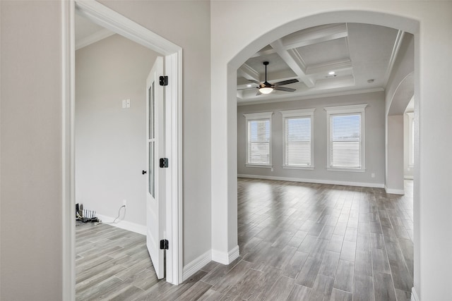 hall featuring coffered ceiling, crown molding, beamed ceiling, and light hardwood / wood-style flooring