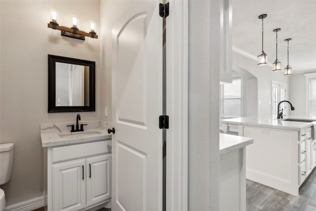 bathroom with vanity and toilet